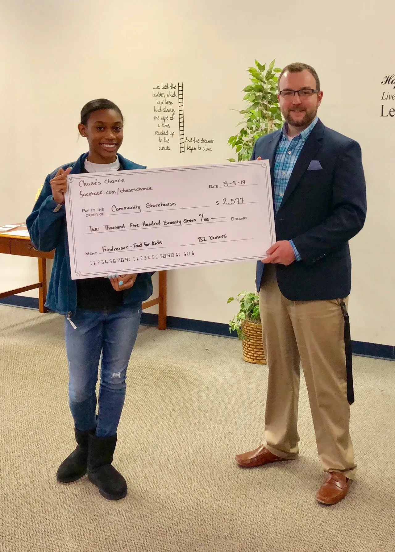 Chase's Chance presenting a fundraiser check to Community Storehouse